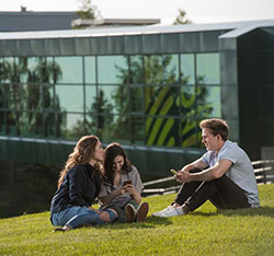 Students sitting on the ground. Links to UAA Announces Largest Estate Gift in University History Estate.jpg